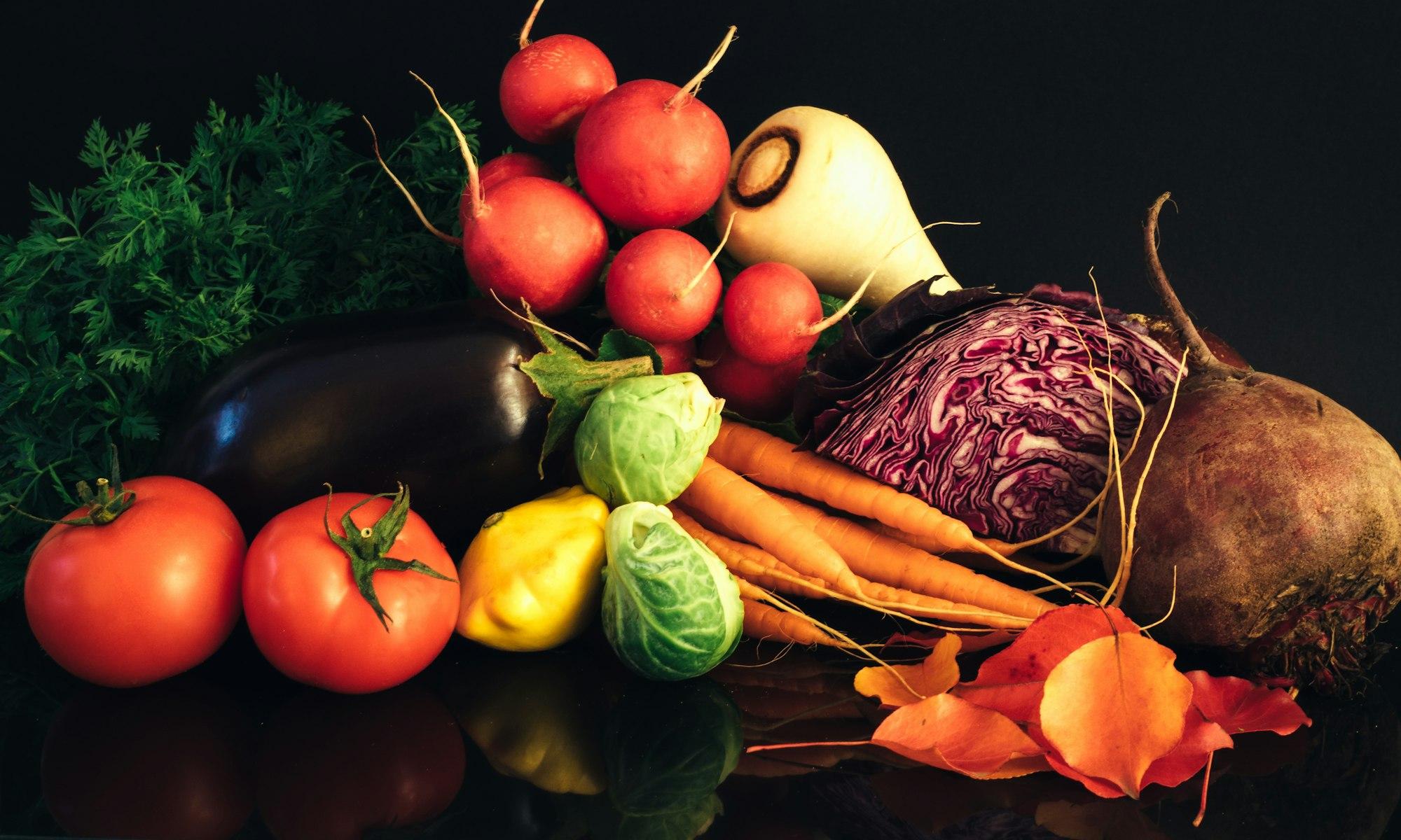 Fresh produce laid out on a dark surface